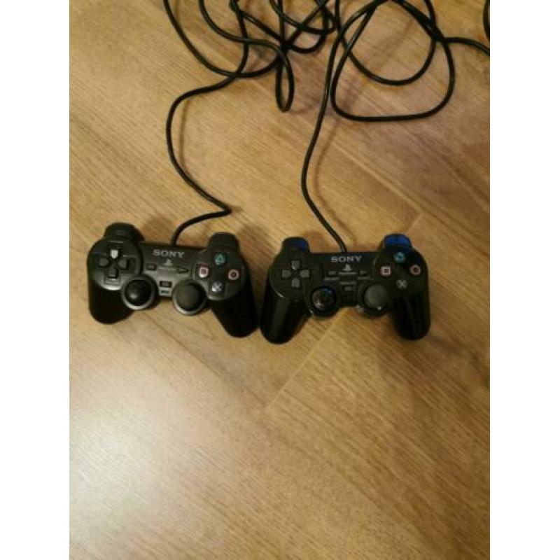 Playstation 2 met 2 controllers veel spellen en singstar