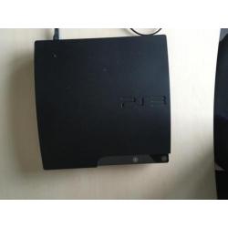 Playstation 3 + 2 controllers & spellen!